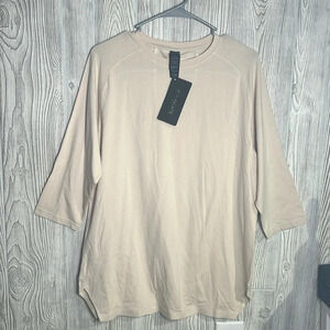 Woman’s alphalete cream T-shirt, three-quarter sleeve size medium